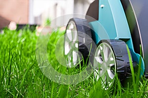 Scarifier on green grass. Work in the garden. scarifier