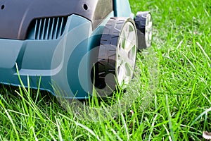 Scarifier on green grass. Work in the garden. scarifier