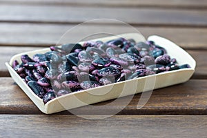 Scarlet runner beans on a wooden table