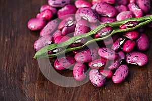 Scarlet running beans - pod, flower and beans on wood