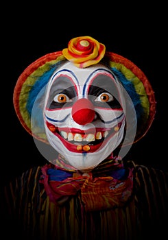 scarry clown face isolated on black background