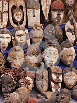 Scary carved African face masks on sale in medina, Essaouira, Morocco