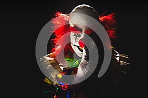 Scary clown on a dark background