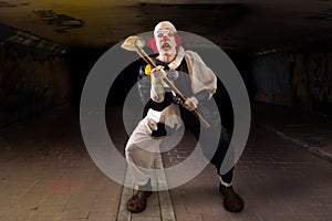 Scary clown with a hammer