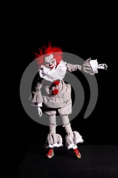 Scary clown killer on a black background. horror. Halloween concept. creepy look