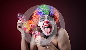 Scary clown with spooky makeup and more candy