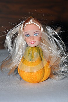 Scary doll with a pumpkin torso. Halloween