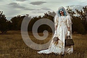 Scary evil clown in a bride dress