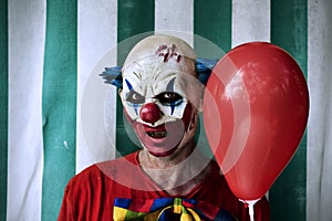Scary evil clown in the circus