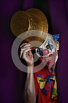 Scary evil clown at the stage