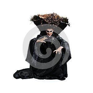 Scary witch casting a spell