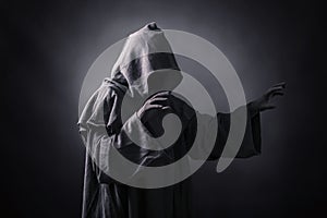 Scary figure in hooded cloak