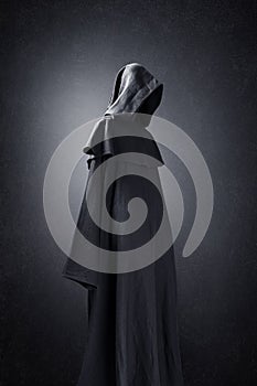 Scary figure in hooded cloak