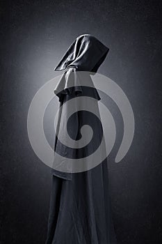 Scary figure in hooded cloak photo