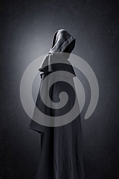 Scary figure in hooded cloak photo