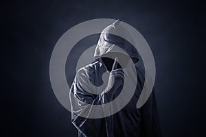 Scary figure in hooded cloak photo