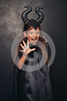 Scary girl in devil costume