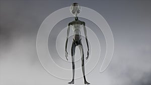 Scary gray alien stands and looks blinking on a dark smoky background. UFO futuristic concept. 3D rendering.