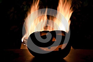 Scary Halloween background with fire flames. Jack o lantern head