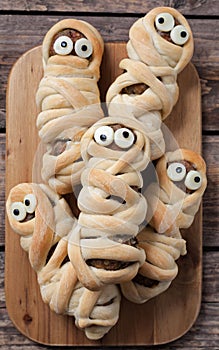 Scary halloween food sausage meatball mummies in