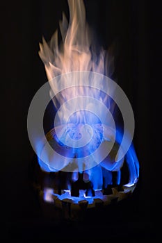 Scary halloween pumpkin burning with flame on a black background