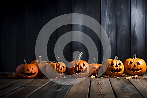 Scary Halloween pumpkins with evil eyes and faces on a wooden dark background