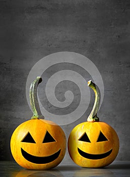 Scary Halloween pumpkins isolated on a black background. Scary smiling faces trick or treat.