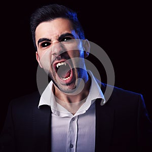 Scary man with black eyes and fangs photo
