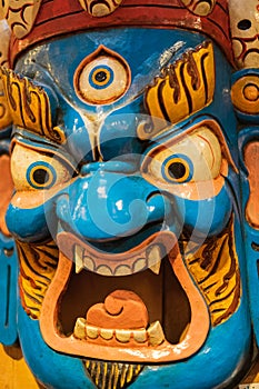 Scary Nepali mask in the market. Colorful mask used for dancing at a yearly festival called Tsechu to celebrate Buddhism