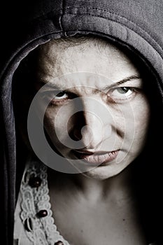 Scary sinister woman with spooky evil eyes photo