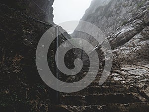 Scary steep hiking path stairs on steep mountain. hiking path stone, brienzer rothorn switzerland