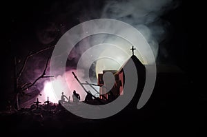 Scary view of zombies at cemetery dead tree, moon, church and spooky cloudy sky with fog, Horror Halloween concept