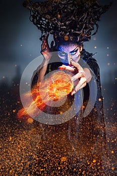 Scary witch summoning a spell