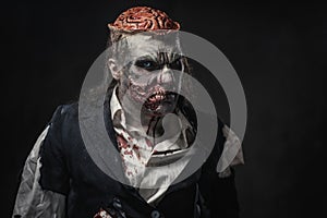 Scary zombie prostheric makeup on male model