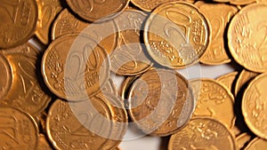 Scattered 20 euro cent coins, rotating money background