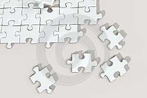 Scattered blank puzzles with white background, 3d rendering