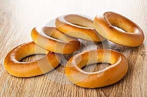 Scattered bread rings baranka on table photo
