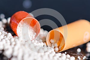 Scattered capsule. Pharmacy background on a black table. Tablets on a black background. Pills. Medicine and healthy.