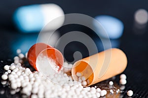 Scattered capsule. Pharmacy background on a black table. Tablets on a black background. Pills. Medicine and healthy.