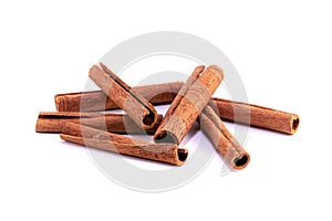 Scattered cinnamon sticks on white background. Isolated. Copy space for text.