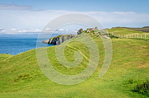 Scattered clifftop ruins of a medieval castle, former seat of the Clan MacDonald, abandoned in 1739