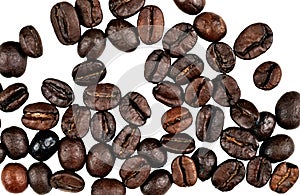 Scattered coffee beans on white background