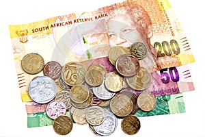 Scattered Coins on Three South African Bank Notes
