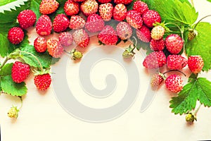 A scattered crop of wild strawberries. Red ripe berry on a light background. Diet Concept Food Light Banner Tinted
