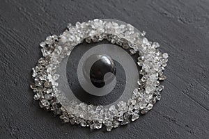 Scattered diamonds on a black background. Raw diamonds and mining, a scattering of natural diamond stones. Graphite quartz.