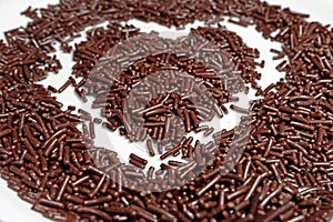 Chocolate meses with a heart shape in the middle photo