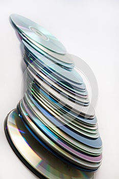 Scattered old compact discs on a white background