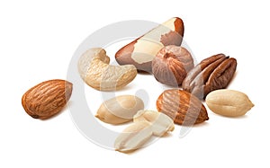 Scattered pecan, hazelnut, almond, peanut and brazil nuts isolated on white background