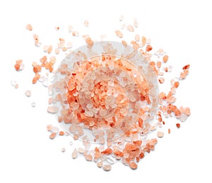 Scattered pink himalayan salt on background, top view