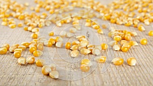 Scattered ripe dried yellow corn on wooden desk